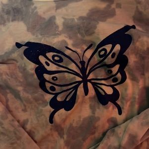 A long sleeve with a sparkly butterfly